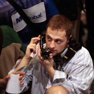 A trader holds two phones to his ears during activity in the crude oil options area on the floor of the New York Mercantile Exchange March 6, 2008 in New York City. Oil prices rose to a record of nearly $106 a barrel before steadying by mid-day.