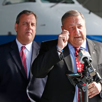 Maine Gov. Paul LePage, right, speaks to reporters while visiting C&L Aviation with New Jersey Gov. Chris Christie, Tuesday, Aug. 12, 2014, in Bangor, Maine. Christie returned to Maine to campaign for LePage's re-election campaign. (AP Photo/Robert F. Bukaty)