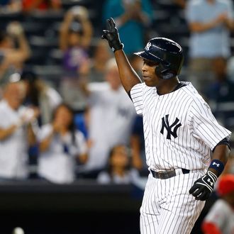 Alfonso Soriano #12 of the New York Yankees celebrates his seventh inning three-run home run against the Los Angeles Angels of Anaheim at Yankee Stadium on August 13, 2013 in the Bronx borough of New York City. 