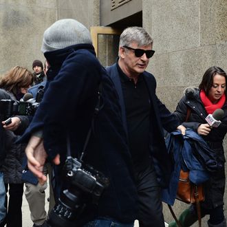Actor Alec Baldwin (C) leaves Manhattan Criminal Court through a crowd of media after testifying against accused stalker Canadian actress Genevieve Sabourin November 12, 2013 in New York. AFP PHOTO/Stan HONDA (Photo credit should read STAN HONDA/AFP/Getty Images)