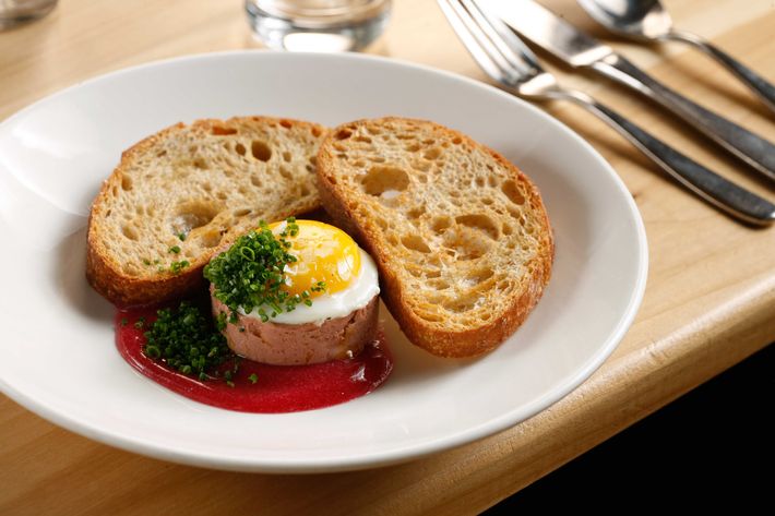 Chicken liver and foie gras, sunny-side egg, Concord grape.
