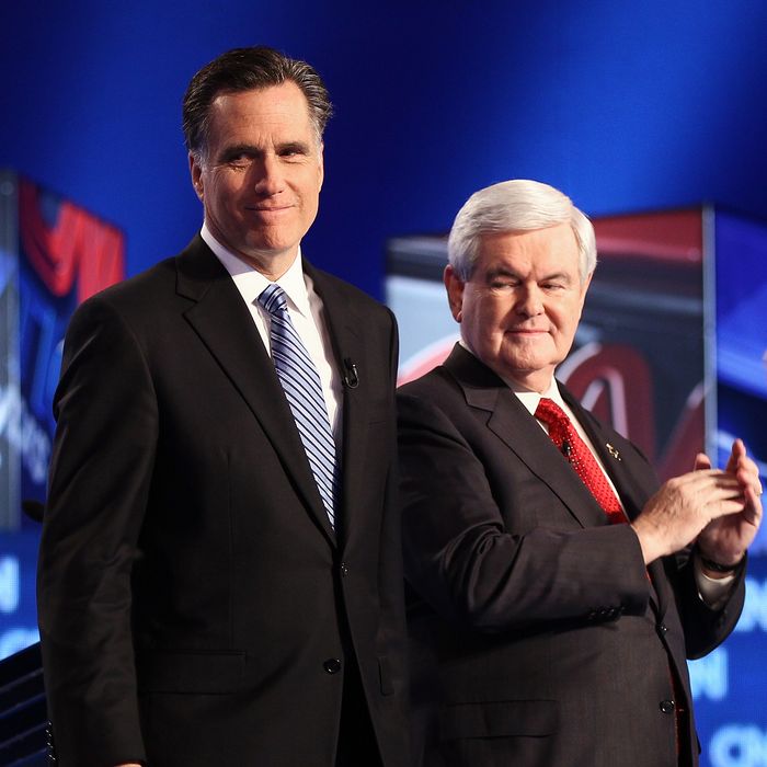 CHARLESTON, SC - JANUARY 19: Republican presidential candidates (L-R) former Speaker of the House Newt Gingrich, and former Massachusetts Gov. Mitt Romney arrive on stage before a debate at the North Charleston Coliseum January 19, 2012 in Charleston, South Carolina. The debate, hosted by CNN and the Southern Republican Leadership Conference, is the final debate before South Carolina voters head to the polls for their primary January 21. (Photo by Win McNamee/Getty Images)