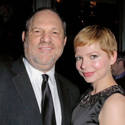 LOS ANGELES, CA - JANUARY 11: Harvey Weinstein poses with actress Michelle Williams at the party hosted by the Weinstein Company and Audi to celebrate awards season at Chateau Marmont on January 11, 2012 in Los Angeles, California. (Photo by Jeff Vespa/Getty Images for Audi)