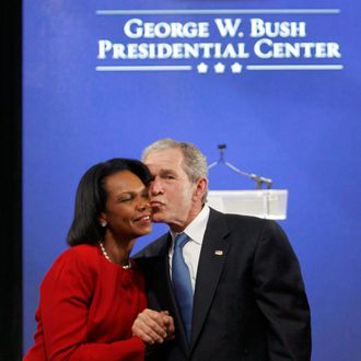 Former U.S. President George W. Bush kisses Former Secretary of State Condolezza Rice