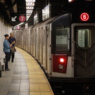 NEW YORK, NY - AUGUST 29: Commuters wait for the subway August 29, 2011 in New York City. One day after Hurricane Irene hit New York the mass transit system, including subways and buses, began moving again in a limited capacity in time for Monday's rush hour. (Photo by Joe Raedle/Getty Images)