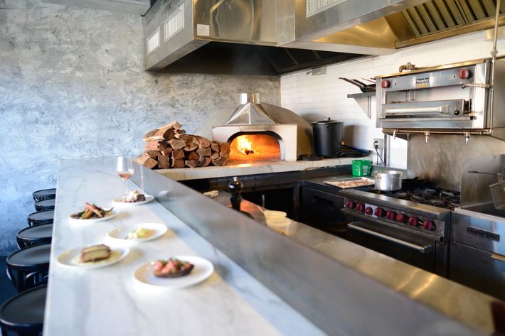 The wood-burning oven and kitchen counter.