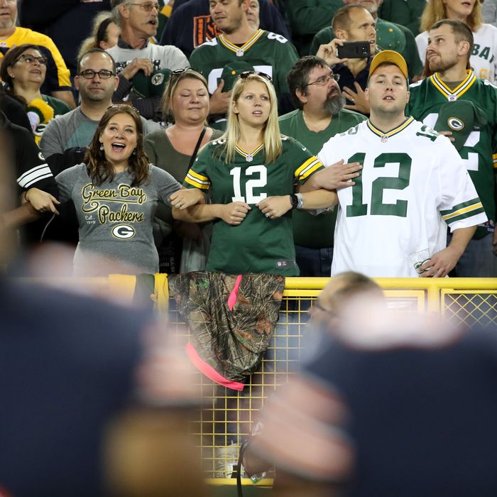 Green Bay Packers fans honor veterans and current service members during  the National Anthem at the…