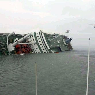 JINDO-GUN, SOUTH KOREA - APRIL 16: In this handout image provided by the Republic of Korea Coast Guard, a passenger ferry sinks off the coast of Jindo Island on April 16, 2014 in Jindo-gun, South Korea. The ferry identified as the Sewol was carrying about 470 passengers, including students and teachers, traveling to Jeju island. (Photo by The Republic of Korea Coast Guard via Getty Images)