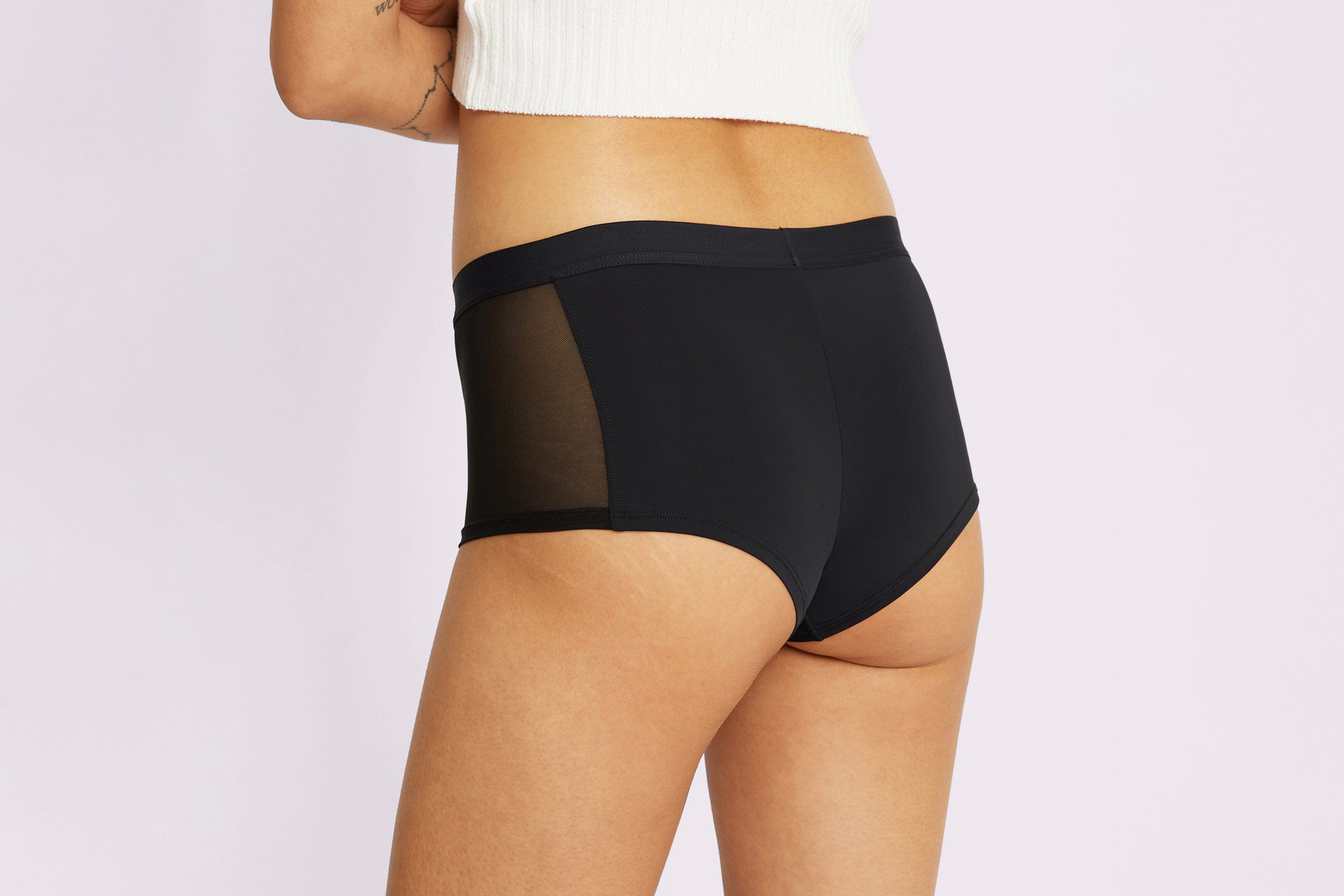 Model looking ass in black panty and long slender legs