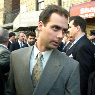 New York City police officer Kenneth Boss makes his way through the crowd from the Bronx Courthouse to address the press 31 March, 1999 in New York. Boss and three other officers have been charged with second degree murder for shooting 41 times and hitting 19 times 04 February 1999 Amadou Diallo, a street vendor from Guinea.