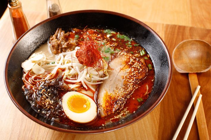 Spicy tonkotsu ramen with pork belly, ground pork, soft-boiled egg, fried garlic, and kikurage mushrooms.