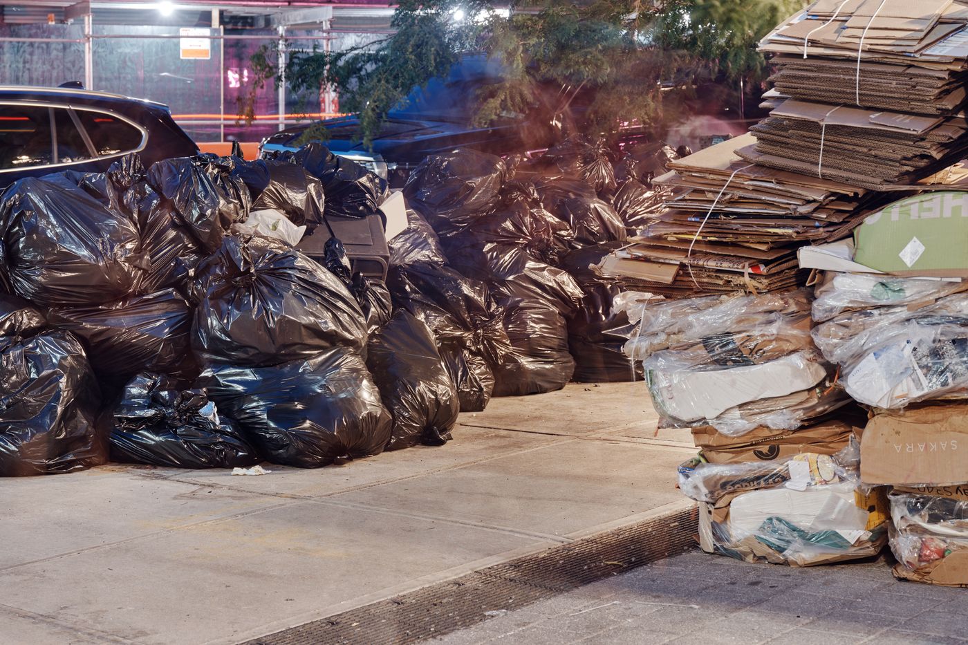 Premium Photo  Heap of plastic trash bags on curb waiting for