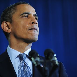 US President Barack Obama pauses as he speaks on the economy and an extension of the payroll tax cut at Osawatomie High School December 6, 2011 in Osawatomie, Kansas.