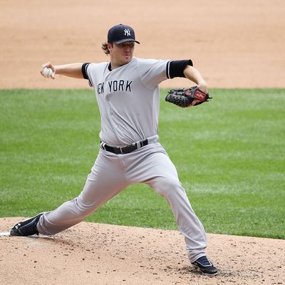 Phil Hughes #65 of the New York Yankees pitches in the fifth inning during the game against the Detroit Tigers