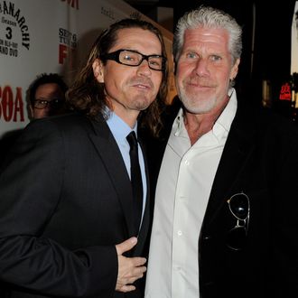 Executive producer Kurt Sutter (L) and actor Ron Perlman arrive at a screening of FX's 