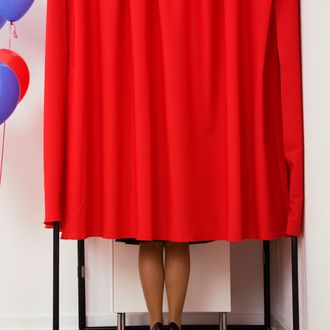 Voting booth --- Image by ? VStock LLC/Tetra Images/Corbis