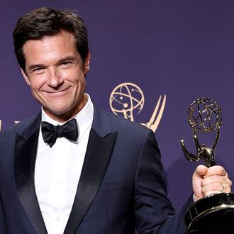 Jason Bateman looks glum despite wearing cap of his division