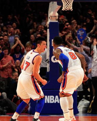 NEW YORK, NY - FEBRUARY 19: Jeremy Lin #17 of the New York Knicks reacts with teammate J.R. Smith #8 during the game against the Dallas Mavericks at Madison Square Garden on February 19, 2012 in New York City. NOTE TO USER: User expressly acknowledges and agrees that, by downloading and/or using this Photograph, user is consenting to the terms and conditions of the Getty Images License Agreement. (Photo by Chris Trotman/Getty Images)