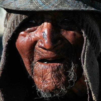 Carmelo Flores Laura, a native Aymara, speaks during an interview outside his home in the village of Frasquia, Bolivia, Tuesday, Aug. 13, 2013. If Bolivia’s public records are correct, Flores is the oldest living person ever documented. They say he turned 123 a month ago. To what does the cattle and sheepherder owe his longevity? “I walk a lot, that’s all. I go out with the animals,” he says. 