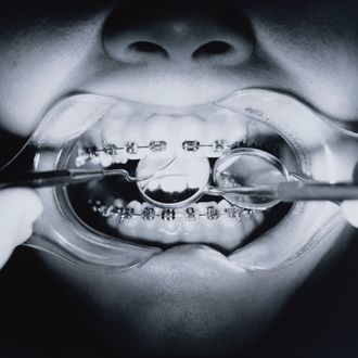 Dentist Examining Mouth