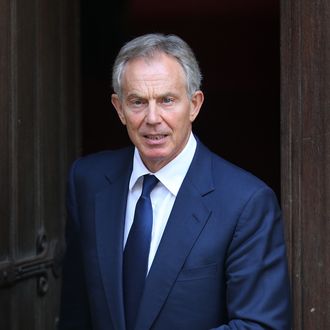 LONDON, ENGLAND - MAY 28: Former Prime Minister Tony Blair leaves The Royal Courts of Justice by a side door after giving evidence to The Leveson Inquiry on May 28, 2012 in London, England. This phase of the inquiry into the culture, practice and ethics of the press in the United Kingdom is looking at the relationship between the press and politicians. The inquiry, which may take a year or more to complete, comes in the wake of the phone hacking scandal that saw the closure of The News of The World newspaper in 2011. (Photo by Peter Macdiarmid/Getty Images)