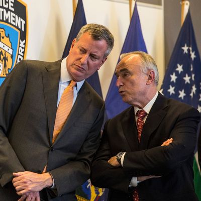 NEW YORK, NY - DECEMBER 04: New York City Mayor Bill de Blasio and New York Police Department (NYPD) Commissioner Bill Bratton review new police guidelines that will be taught to police officers at the Police Academy on December 4, 2014 in the College Point neighborhood of the Queens borough of in New York City. The new police guidelines come on the heels of numerous national incidences where white police officers have killed black men. (Photo by Andrew Burton/Getty Images)