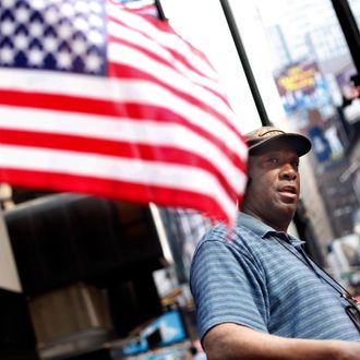 Duane Jackson sets up his sales stand while talking to reporters in Times Square in New York, Sunday, May 2, 2010.