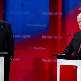 Republican presidential hopefuls, Mitt Romney (L) and Newt Gingrich, take the stage for the NBC News, Tampa Bay Times, National Journal Republican Presidential Candidates Debate at the University of South Florida, January 23, 2012, Tampa, Florida. AFP Photo/Paul J. Richards (Photo credit should read PAUL J. RICHARDS/AFP/Getty Images)