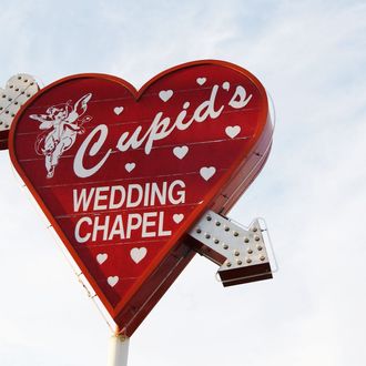 LAS VEGAS, NV - MAY 30: Cupid's Wedding Chapel sign is seen on display on May 30, 2002 in Las Vegas, Nevada. (Photo by Robert Mora/Getty Images)