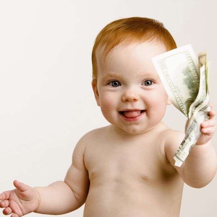 Baby holding wad of money