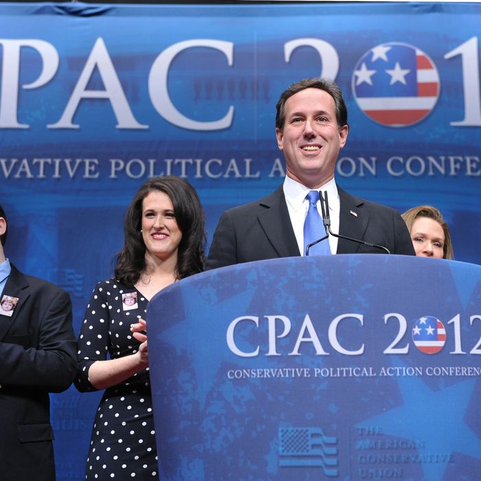 Presidential candidate and former Pennsylvania senator Rick Santorum arrives on stage to speak during an address to the 39th Conservative Political Action Committee February 10, 2012 in Washington, DC.