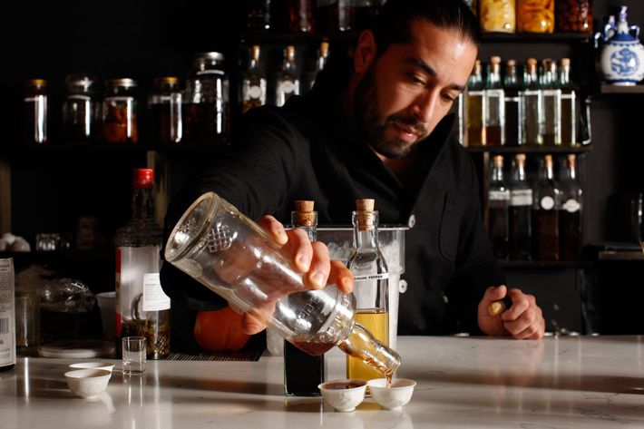 Salicetti pours some of his house-infused baijiu.