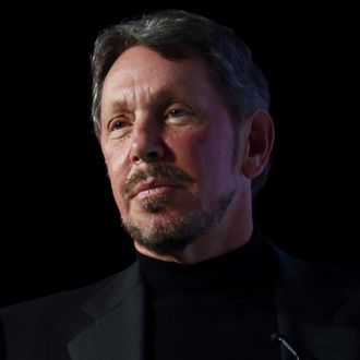 Larry Ellison, chief executive officer of Oracle Corp., gestures as he makes a speech at the New Economy Summit 2014 in Tokyo, Japan, on Wednesday, April 9, 2014. 