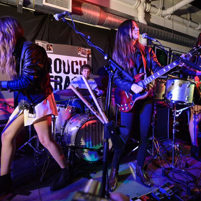  Alana Haim, Dash Hutton, Danielle Haim and Este Haim of the band Haim perform on stage at Rough Trade East on October 1, 2013 in London, England. (Photo by Andy Sheppard/Redferns via Getty Images)