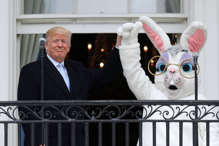 President Donald Trump and a person in an Easter Bunny costume welcome guests to the White House Easter Egg Roll on April 22, 2019.