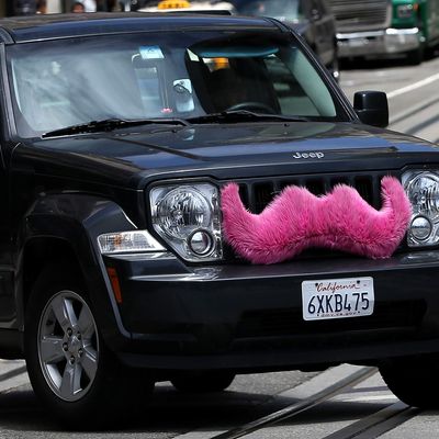 SAN FRANCISCO, CA - JUNE 12: A Lyft car drives along Powell Street on June 12, 2014 in San Francisco, California. The California Public Utilities Commission is cracking down on ride sharing companies like Lyft, Uber and Sidecar by issuing a warning that they could lose their ability to operate within the state if they are caught dropping off or picking up passengers at airports in California. (Photo by Justin Sullivan/Getty Images)