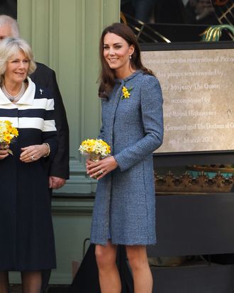 Queen Elizabeth II, Camilla, Duchess Of Cornwall and Catherine, Duchess Of Cambridge visit Fortnum and Mason store on Piccadilly. The Royal Trio smiled as they walked out the shop to loud cheers from the large crowd that gathered outside the shop. Catherine Middleton wore a blue coat by Italian label Missoni and shoes by Rupert Sanderson. Catherine Middleton The Duchess Of Cambridge also sported two daffodils on her lapel in honour of St Davids day. The Queen Elizabeth II also unveiled a plaque to commemorate the regeneration of Piccadilly outside the Fortnum & Mason Store