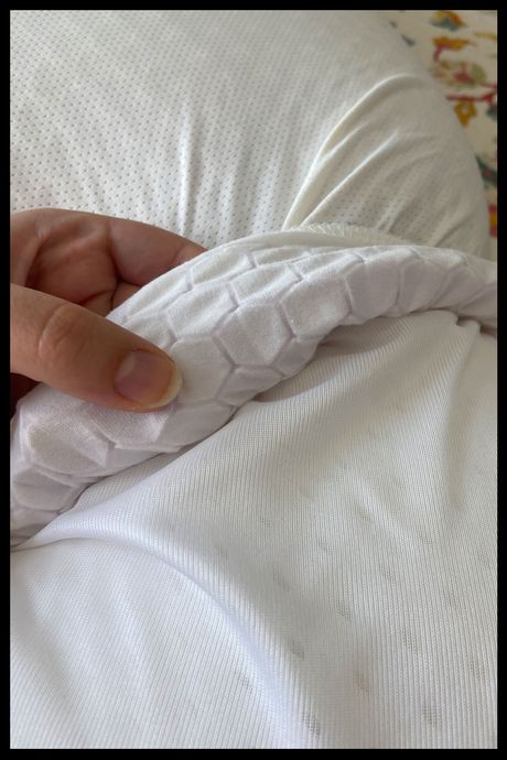 The Purple Harmony pillow unzipped to show the honeycomb-shaped grid.