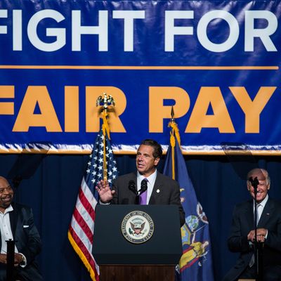 Cuomo announcing his support for a $15 minimum wage last September.