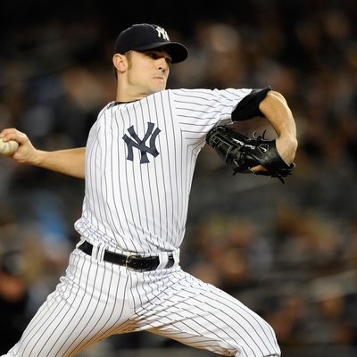 NEW YORK, NY - OCTOBER 06: David Robertson #30 of the New York Yankees throws a pitch against the Detroit Tigers during Game Five of the American League Championship Series at Yankee Stadium on October 6, 2011 in the Bronx borough of New York City. (Photo by Patrick McDermott/Getty Images) *** Local Caption *** David Robertson