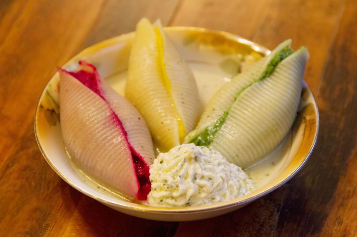 Shells stuffed with, from left, beets, butternut squash, and broccoli, with ricotta on the side.