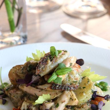 Warm smoked potato-seafood salad, with mussels, shrimp, octopus and lemon-mustard vinaigrette
