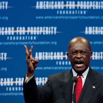US Republican presidential hopeful Herman Cain arrives to address the 
