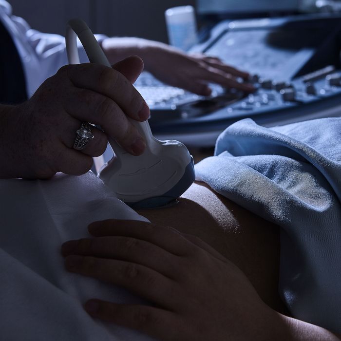 A close-up of a pregnant woman getting an ultrasound.