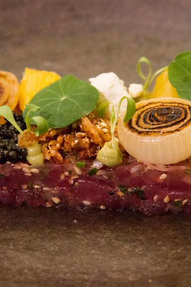Bigeye-tuna tartare with caviar, pickled vegetables, and soy vinegar.