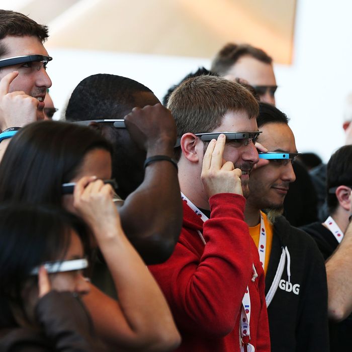 Attendees wear Google Glass while posing for a group photo during the Google I/O developer conference on May 17, 2013 in San Francisco, California. Eight members of the Congressional Bi-Partisan Privacy Caucus sent a letter to Google co-founder and CEO Larry Page seeking answers to privacy questions and concerns surrounding Google's photo and video-equipped glasses called 