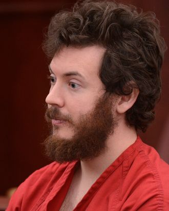 James Holmes, Aurora theater shooting suspect, sits in the courtroom during his arraignment in Centennial, Colo., on Tuesday, March 12, 2013. Judge William Blair Sylvester entered a not guilty plea on behalf of James Holmes on Tuesday after the former graduate student's defense team said he was not ready to enter one. 