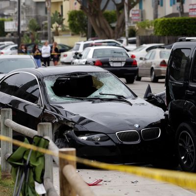 A black BMW sedan driven by a drive-by shooter is seen on Saturday, May 24, 2014, in Isla Vista, Calif. The shooter went on a rampage near a Santa Barbara university campus that left seven people dead, including the attacker, and seven others wounded, authorities said Saturday. (AP Photo/Jae C. Hong)