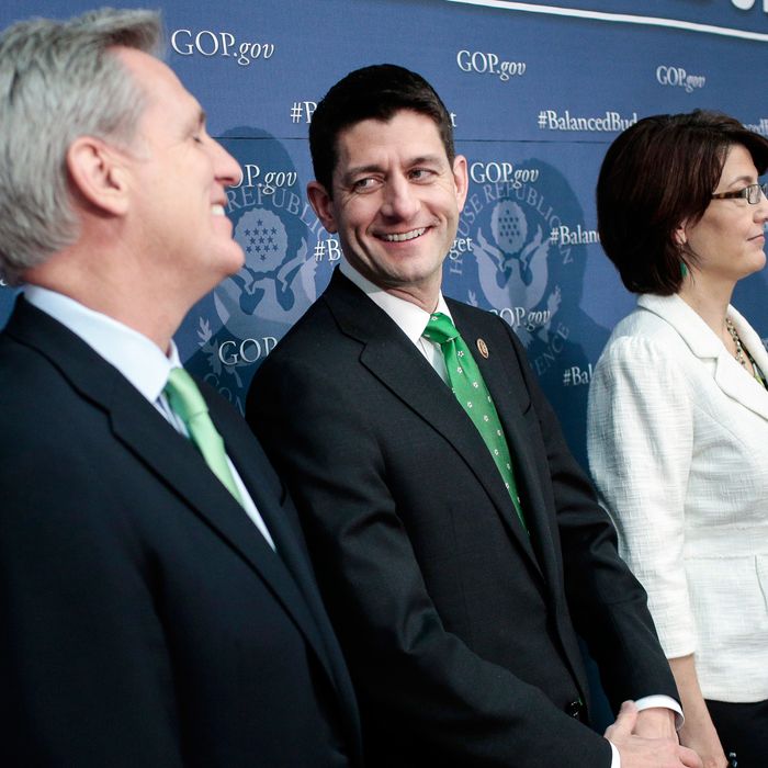 Rep. Paul Ryan (R-WI) (C) jokes with House Majority Whip Kevin McCarthy (R-CA) (L) as House Republican leaders, including House Republican Conference Chairman Cathy McMorris Rodgers (R-WA) address the media after a party conference on March 19, 2013 in Washington, DC. GOP leaders asked that the president work with them to create a balanced budget plan, citing President Clinton's efforts to work with House Republicans on a budget in the 1990s. 