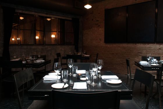 The back dining room with skylights and open kitchen.